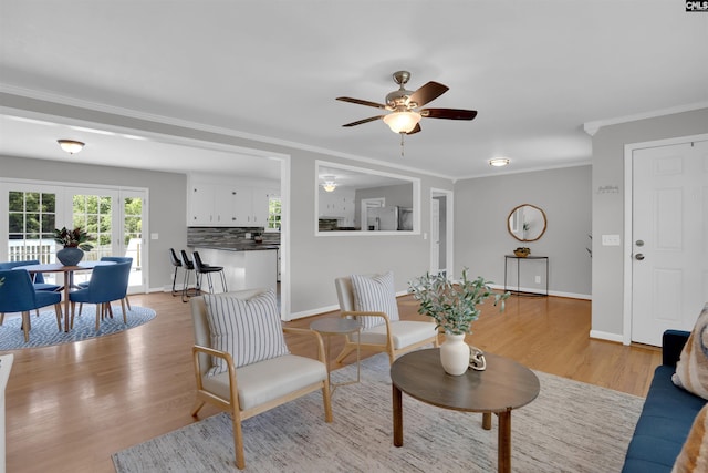 344 Rawls Dr, Leesville, SC 29070 - living room featuring crown molding, ceiling fan, and light wood finished floors