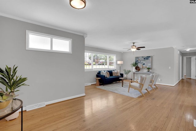 344 Rawls Dr, Leesville, SC 29070 - living area with crown molding, light wood-style floors, and ceiling fan