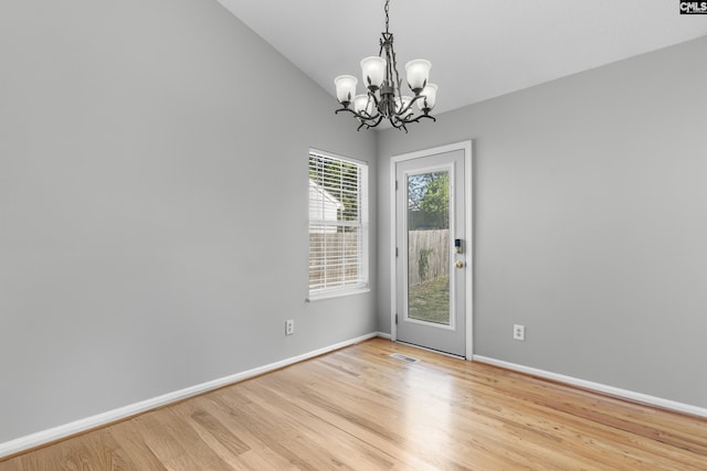 309 Pebble Creek Ct, West Columbia, SC 29170 - spare room with a chandelier and light wood-style floors