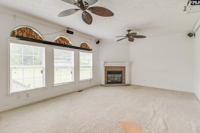 2117 Togetherness Way, Mcbee, SC 29101 - unfurnished living room featuring ornamental molding, a textured ceiling, a ceiling fan, plenty of natural light, and carpet floors