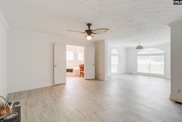 2117 Togetherness Way, Mcbee, SC 29101 - unfurnished living room with a ceiling fan, crown molding, light wood-style floors, and a textured ceiling