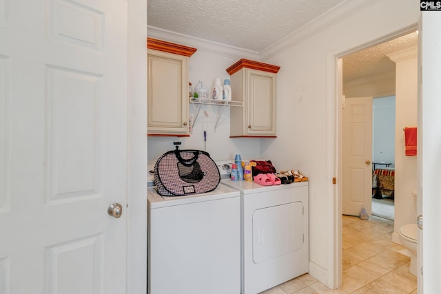 2117 Togetherness Way, Mcbee, SC 29101 - laundry area with separate washer and dryer, a textured ceiling, cabinet space, ornamental molding, and light tile patterned floors