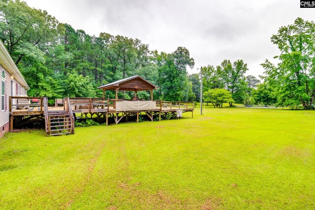 2117 Togetherness Way, Mcbee, SC 29101 - view of grassy yard with a gazebo, view of scattered trees, and a wooden deck