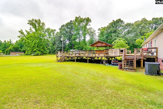 2117 Togetherness Way, Mcbee, SC 29101 - view of grassy yard featuring stairs, a deck, and view of wooded area