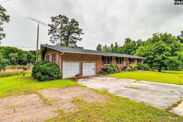 2117 Togetherness Way, Mcbee, SC 29101 - ranch-style home with brick siding, a front lawn, an attached garage, and concrete driveway