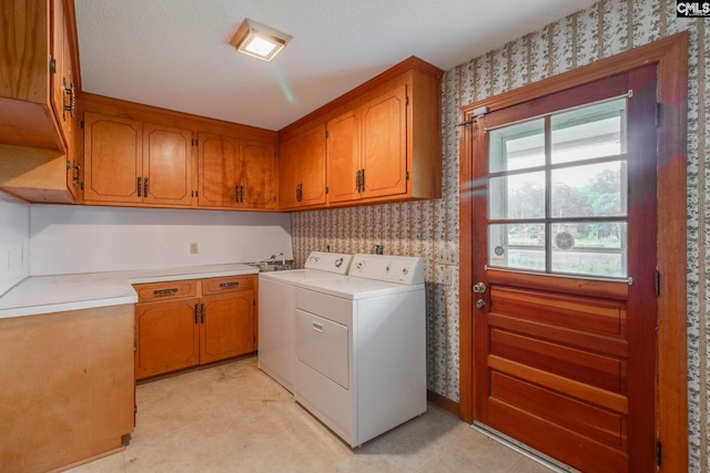 2117 Togetherness Way, Mcbee, SC 29101 - laundry room featuring cabinet space, washing machine and clothes dryer, and wallpapered walls