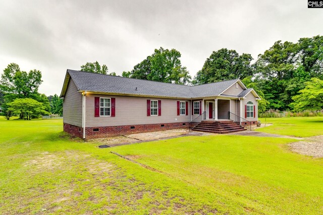 2117 Togetherness Way, Mcbee, SC 29101 - view of front of home with crawl space, a front lawn, and a shingled roof