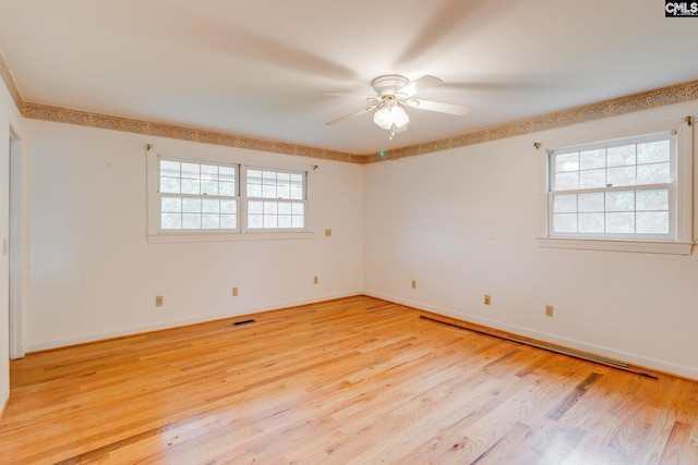 2117 Togetherness Way, Mcbee, SC 29101 - spare room with a ceiling fan, light wood-type flooring, and a baseboard radiator