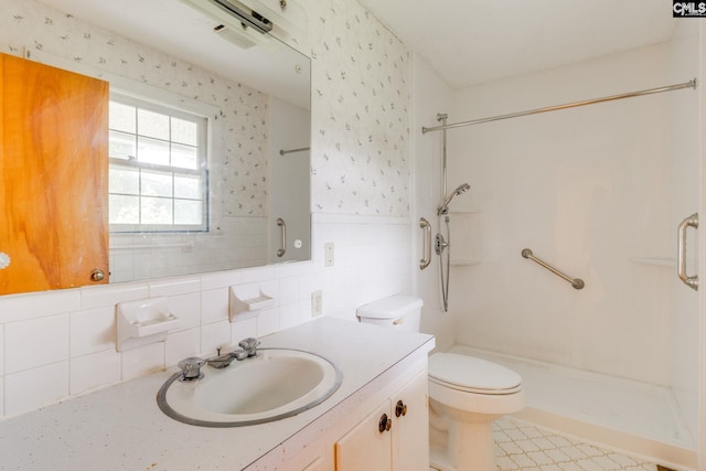2117 Togetherness Way, Mcbee, SC 29101 - full bath featuring a shower stall, wallpapered walls, vanity, wainscoting, and decorative backsplash