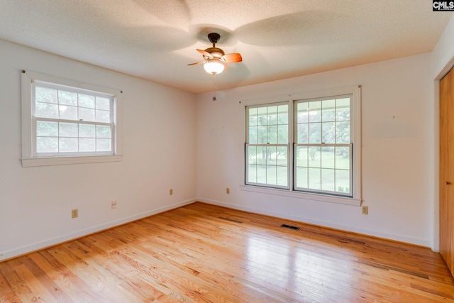 2117 Togetherness Way, Mcbee, SC 29101 - empty room featuring light wood finished floors, ceiling fan, and a textured ceiling
