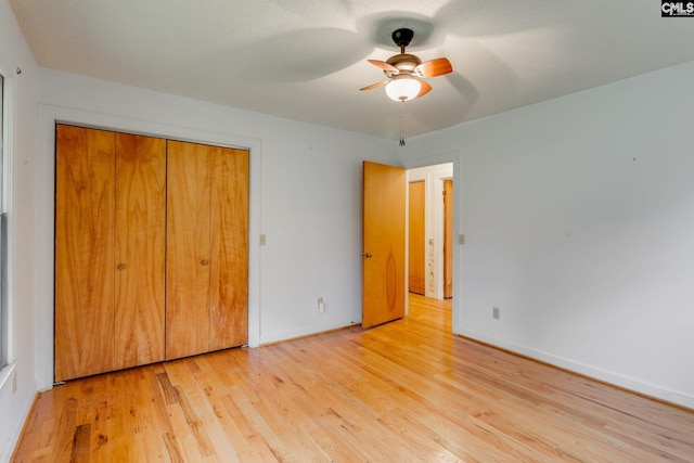 2117 Togetherness Way, Mcbee, SC 29101 - unfurnished bedroom with wood finished floors, a closet, and a ceiling fan
