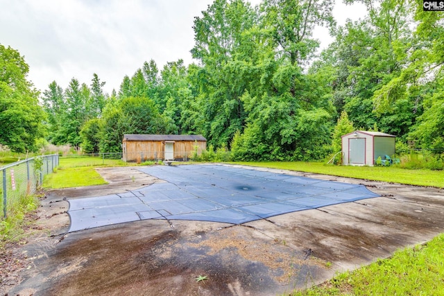 2117 Togetherness Way, Mcbee, SC 29101 - view of pool featuring a patio and a storage shed