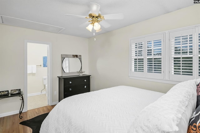 152 Carlyle Cir, Columbia, SC 29206 - bedroom featuring attic access, wood finished floors, multiple windows, and a ceiling fan