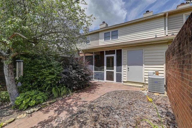 152 Carlyle Cir, Columbia, SC 29206 - rear view of house with a sunroom and a chimney