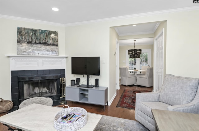 152 Carlyle Cir, Columbia, SC 29206 - living room featuring wood finished floors, ornamental molding, a tiled fireplace, recessed lighting, and a chandelier