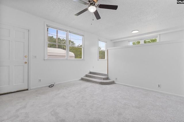 1409 Hazel St, Cayce, SC 29033 - carpeted empty room with a textured ceiling and a ceiling fan