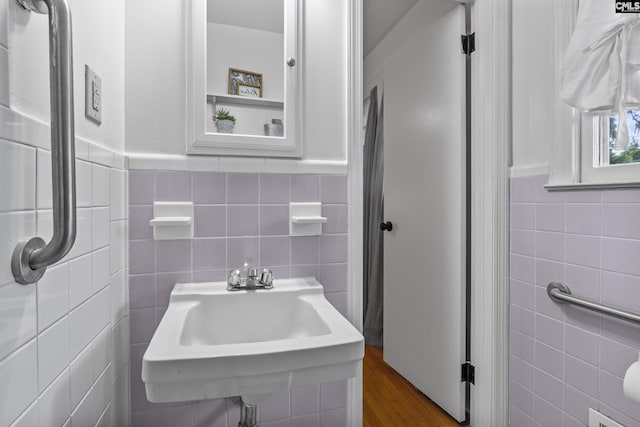 1409 Hazel St, Cayce, SC 29033 - bathroom with tile walls, a wainscoted wall, and wood finished floors