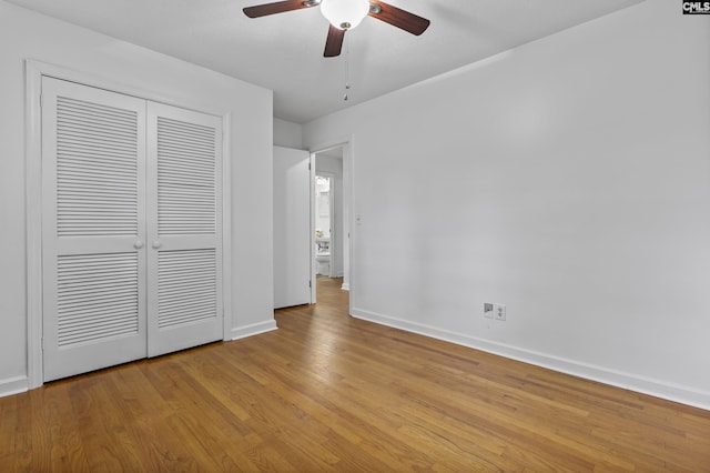 1409 Hazel St, Cayce, SC 29033 - unfurnished bedroom featuring wood finished floors, a closet, and ceiling fan