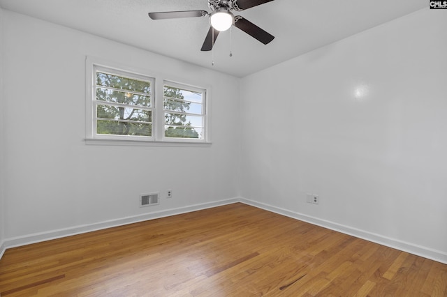 1409 Hazel St, Cayce, SC 29033 - empty room with light wood finished floors and ceiling fan