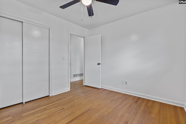 1409 Hazel St, Cayce, SC 29033 - unfurnished bedroom with light wood-style floors, a closet, and ceiling fan