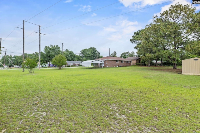 1409 Hazel St, Cayce, SC 29033 - view of grassy yard with a carport