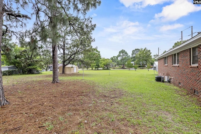 1409 Hazel St, Cayce, SC 29033 - view of grassy yard featuring a storage shed