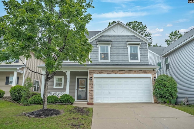 330 Lanyard Ln, Chapin, SC 29036 - view of front facade with driveway, an attached garage, a porch, a front lawn, and stone siding