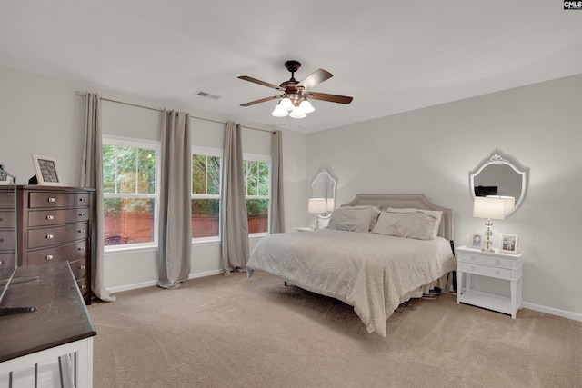330 Lanyard Ln, Chapin, SC 29036 - bedroom with light carpet, multiple windows, and a ceiling fan