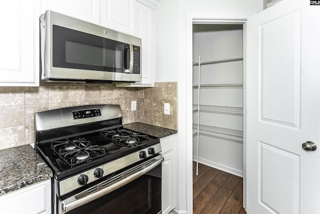 124 Weeping Oak Ln, West Columbia, SC 29169 - kitchen with stainless steel appliances, dark wood-style floors, white cabinets, and tasteful backsplash