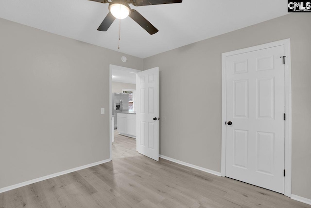 112 Woodcrest Dr, Columbia, SC 29203 - unfurnished bedroom featuring stainless steel fridge, light wood-style floors, and ceiling fan