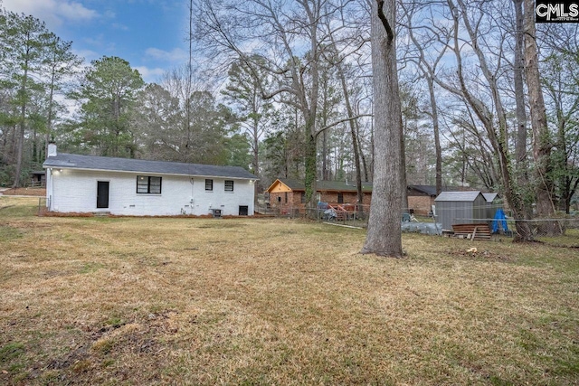 112 Woodcrest Dr, Columbia, SC 29203 - view of yard featuring a storage unit and view of scattered trees
