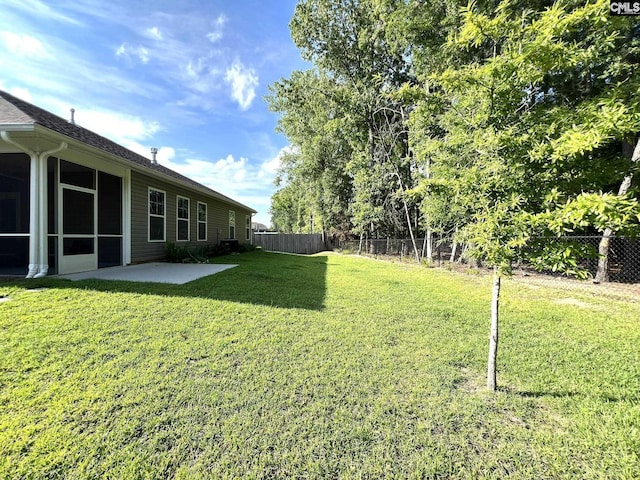 124 Doolittle Dr, Chapin, SC 29036 - fenced backyard with a patio area and a sunroom