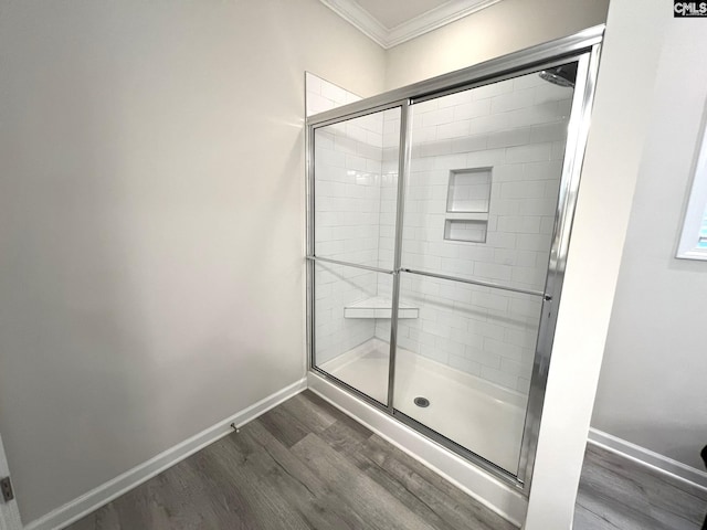 124 Doolittle Dr, Chapin, SC 29036 - bathroom featuring crown molding, wood finished floors, and a stall shower