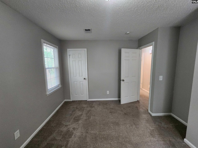 325 Trinity Three Rd, Irmo, SC 29063 - unfurnished bedroom featuring a textured ceiling and carpet