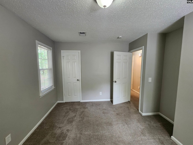 325 Trinity Three Rd, Irmo, SC 29063 - unfurnished bedroom featuring carpet and a textured ceiling