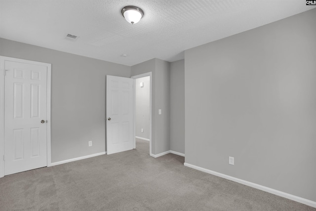325 Trinity Three Rd, Irmo, SC 29063 - unfurnished bedroom featuring carpet and a textured ceiling