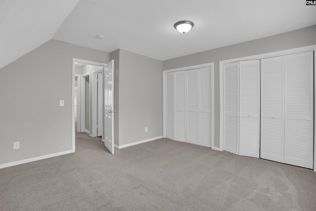 325 Trinity Three Rd, Irmo, SC 29063 - unfurnished bedroom with carpet, two closets, and lofted ceiling