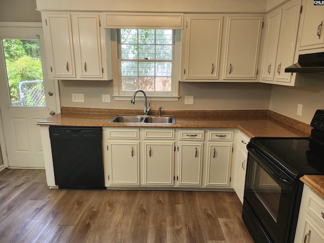325 Trinity Three Rd, Irmo, SC 29063 - kitchen featuring black appliances, under cabinet range hood, wood finished floors, and white cabinets