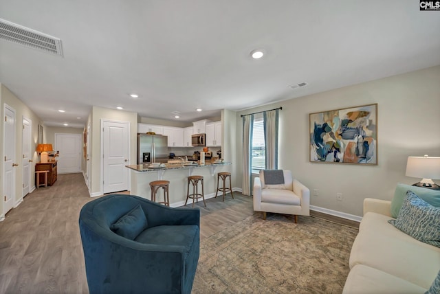 126B Willow Creek Blvd, Lugoff, SC 29078 - living room with light wood-style flooring and recessed lighting