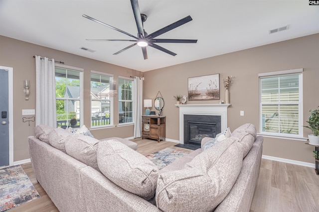 634 Bluff Pointe, Columbia, SC 29212 - living area featuring ceiling fan, light wood-type flooring, and a fireplace with flush hearth