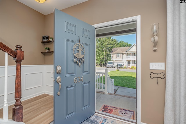 634 Bluff Pointe, Columbia, SC 29212 - foyer with a wainscoted wall, wood finished floors, and stairway