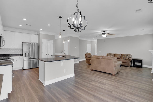 935 Taramore Ln, Lexington, SC 29072 - kitchen featuring appliances with stainless steel finishes, dark countertops, ornamental molding, a ceiling fan, and recessed lighting