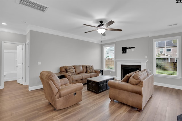 935 Taramore Ln, Lexington, SC 29072 - living area with light wood finished floors, ceiling fan, a fireplace, crown molding, and recessed lighting