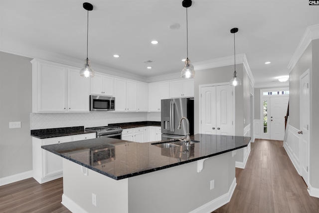 935 Taramore Ln, Lexington, SC 29072 - kitchen with stainless steel appliances, dark wood-type flooring, ornamental molding, white cabinetry, and recessed lighting