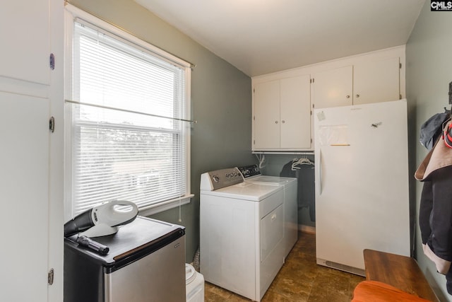 6413 Bridgewood Rd, Columbia, SC 29206 - washroom with washing machine and dryer, cabinet space, and plenty of natural light