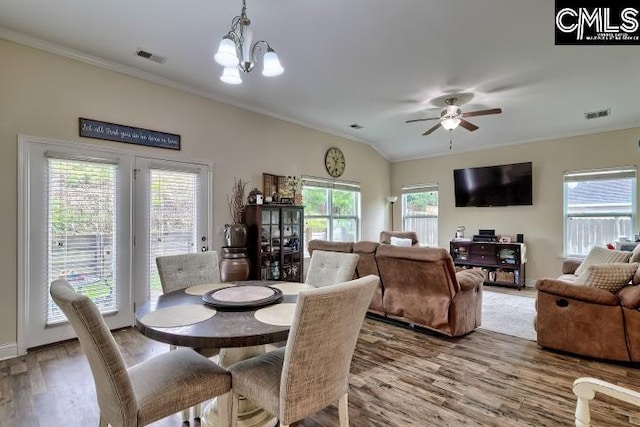 1817 Crystal Ln, West Columbia, SC 29170 - dining space with crown molding, wood finished floors, healthy amount of natural light, a ceiling fan, and vaulted ceiling