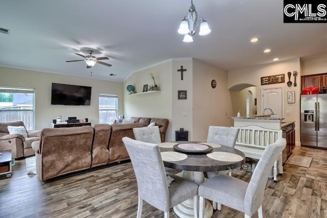 1817 Crystal Ln, West Columbia, SC 29170 - dining space with arched walkways, ceiling fan, healthy amount of natural light, light wood-style floors, and recessed lighting