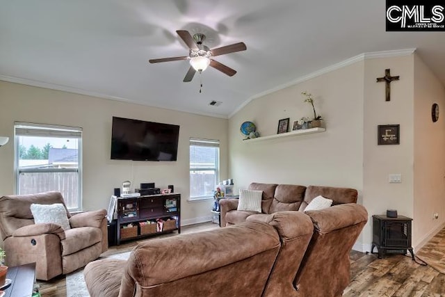 1817 Crystal Ln, West Columbia, SC 29170 - living area with crown molding, a ceiling fan, lofted ceiling, wood finished floors, and a wood stove