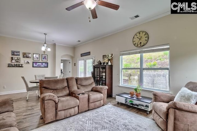 1817 Crystal Ln, West Columbia, SC 29170 - living room with arched walkways, wood finished floors, a ceiling fan, and ornamental molding