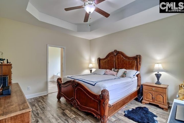 1817 Crystal Ln, West Columbia, SC 29170 - bedroom featuring a raised ceiling, wood finished floors, ceiling fan, and ensuite bathroom